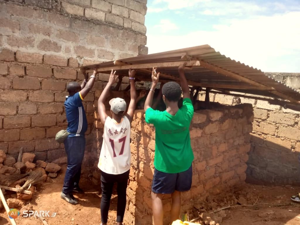 YIM volunteers put a roof on a family home