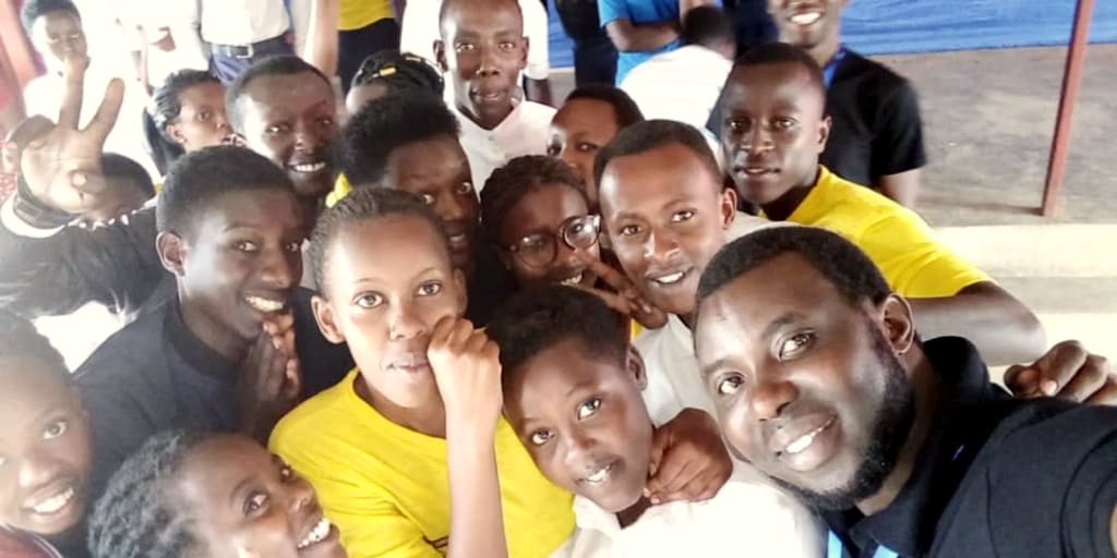 A mentor and students together after a gathering