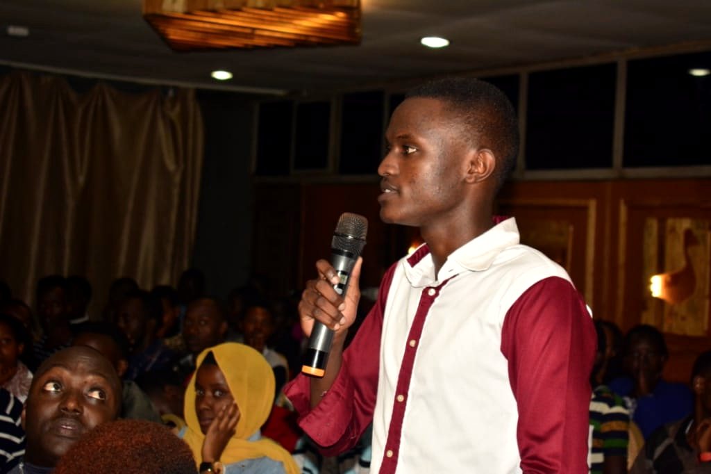 A student leads a session with a microphone